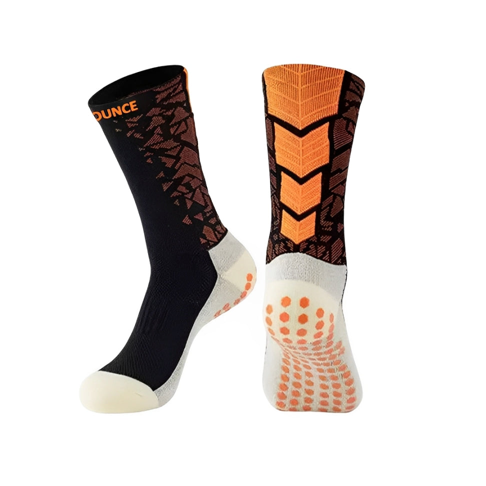 QBounce Grip Socks in black and orange with enhanced grip dots for improved agility and performance.